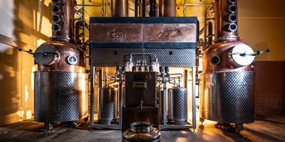 Händler - Wertschöpfung in Österreich: Teilproduktion - Kukmirn Destillerie Puchas