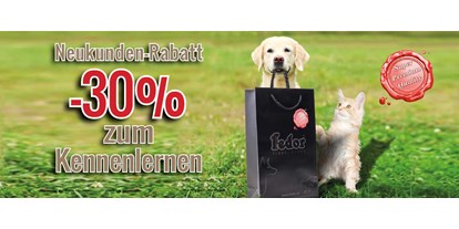 Händler - überwiegend Fairtrade Produkte - Steiermark - Das Bild zeigt eine Katze und einen kleinen Hund neben mit einer Fedor® Tragetasche sitzend. Daneben steht „Neukunden-Rabatt -30% zum Kennenlernen!“ geschrieben. - Fedor® Tiernahrung