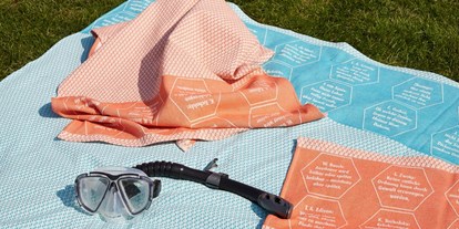 Händler - Produkt-Kategorie: Baby und Kind - Oberösterreich - Strandtücher bzw. Freizeittuch aus BIO-Baumwolle, mit eingewebten Botschaften. - verum textilia by Armin Landskron